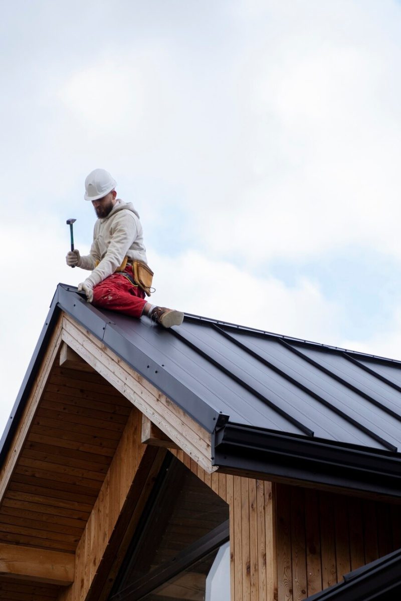 full-shot-man-working-roof_23-2149343677